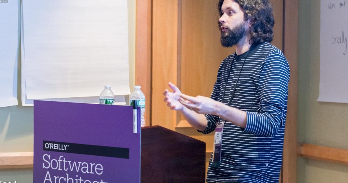 Architectural diagram showing monolithic application transforming into microservices with API gateway